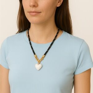 Roxanne Assoulin Black Rope Necklace with Gold Links and White Heart Pendant
